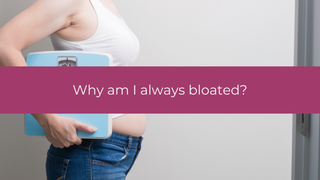 Woman experiencing bloating and digestive discomfort, illustrating chronic bloating causes in women